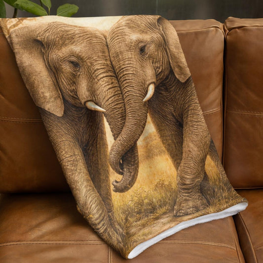 Velveteen blanket featuring two elephants standing together with intertwined trunks in warm natural tones