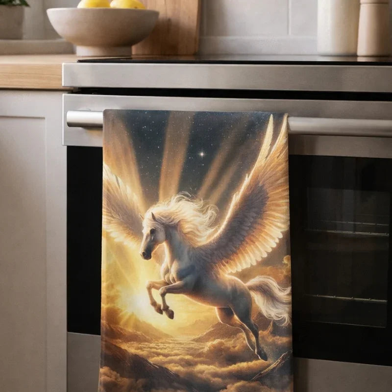 Mythical Pegasus tea towel featuring a radiant winged horse flying above clouds in a kitchen.