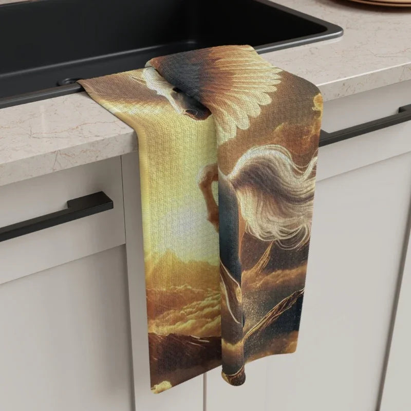 Mythical Pegasus tea towel with winged horse art draped over a modern kitchen sink