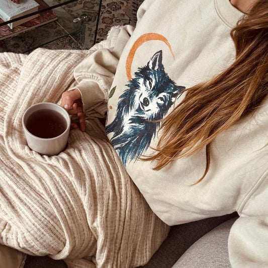 Unisex Gildan 18000 crewneck sweatshirt featuring a mystical wolf design with golden crescent moon and leaf details