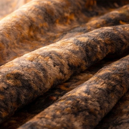 Close-up of a soft, brown and black faux fur blanket with a plush texture