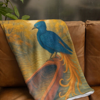 Fantasy-inspired blanket with a blue phoenix and fiery tail draped on a brown couch