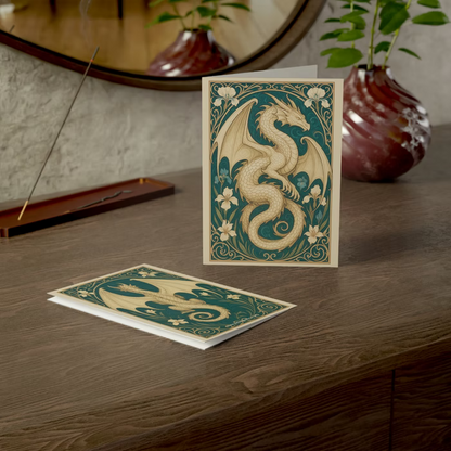 Illustrated white dragon in flowing Art Nouveau style surrounded by floral motifs on a fantasy greeting card.
